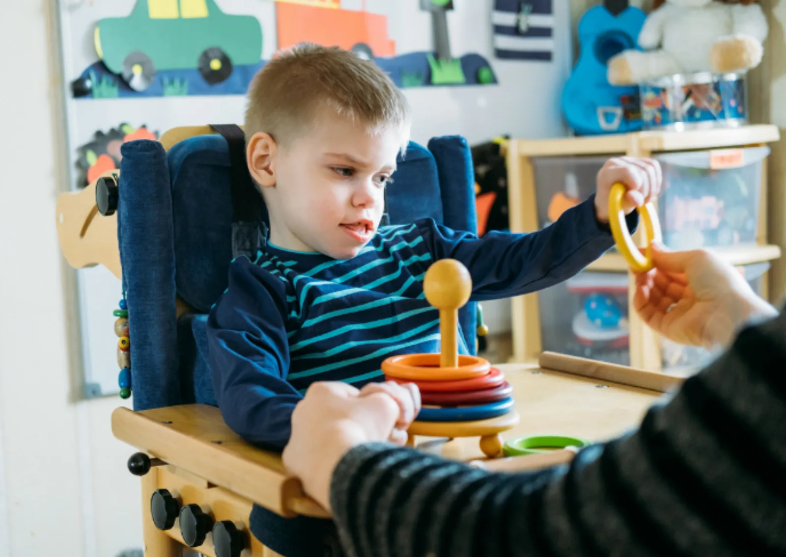 Noon Care support worker engaging a young NDIS participant in a play-based skill building and capacity development activity
