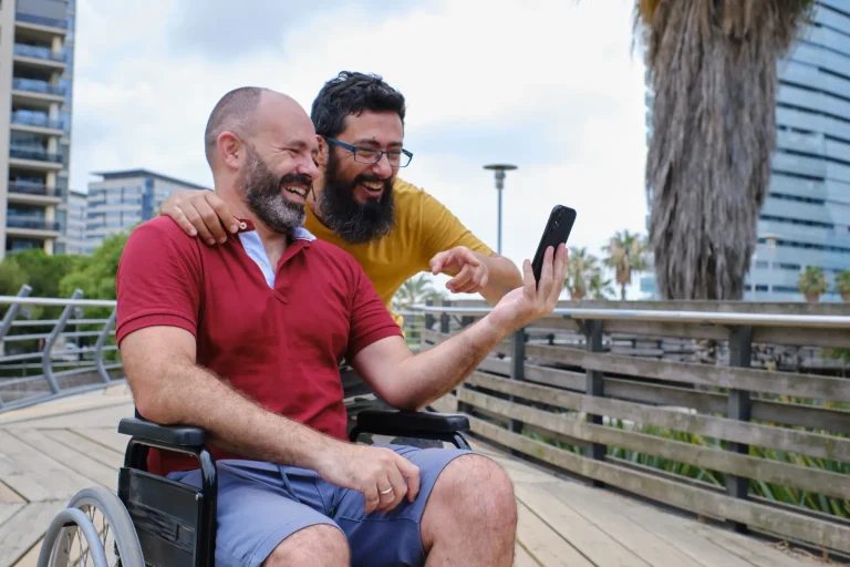 A carer and NDIS participant sharing a warm moment at home, representing Noon Care's Short Term Respite support